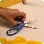 Remove adhesive gunk from scissors