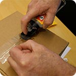 Remove shipping tape from a box