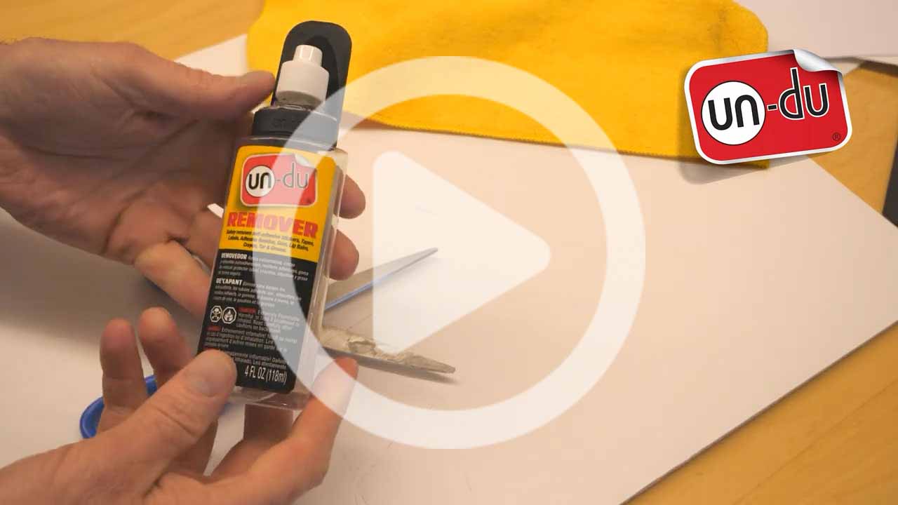 How to remove adhesive gunk from a pair of scissors